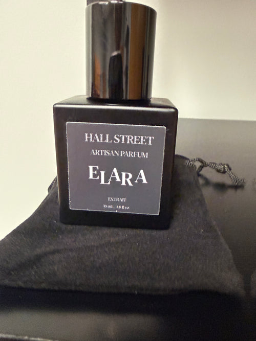 Perfume bottle labeled  Elara by Hall Street Artisan Parfum on a dark background.